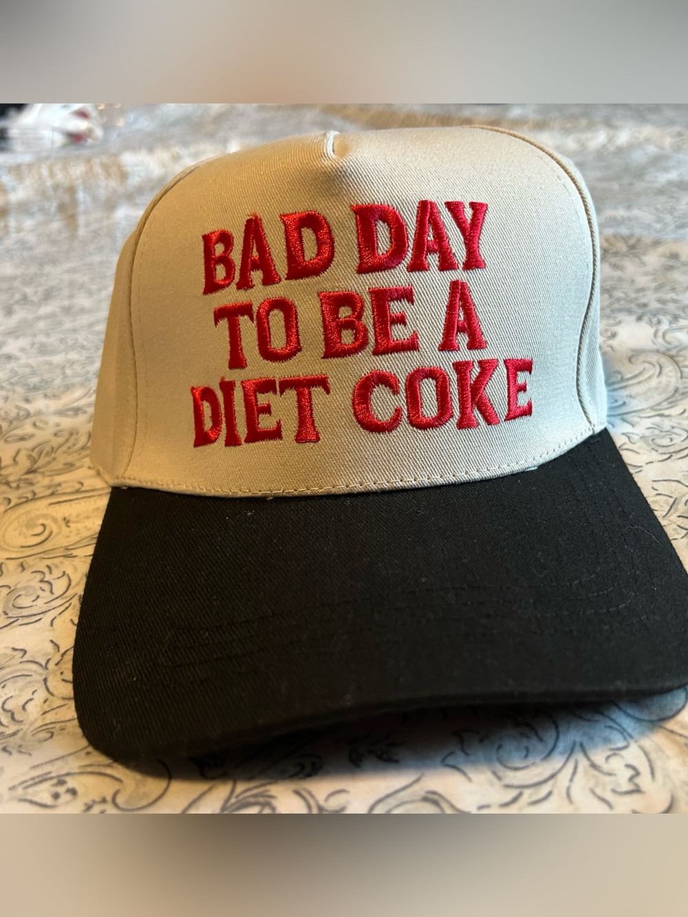 Embroidered Statement Trucker Hat - Cream & Black with Red Text